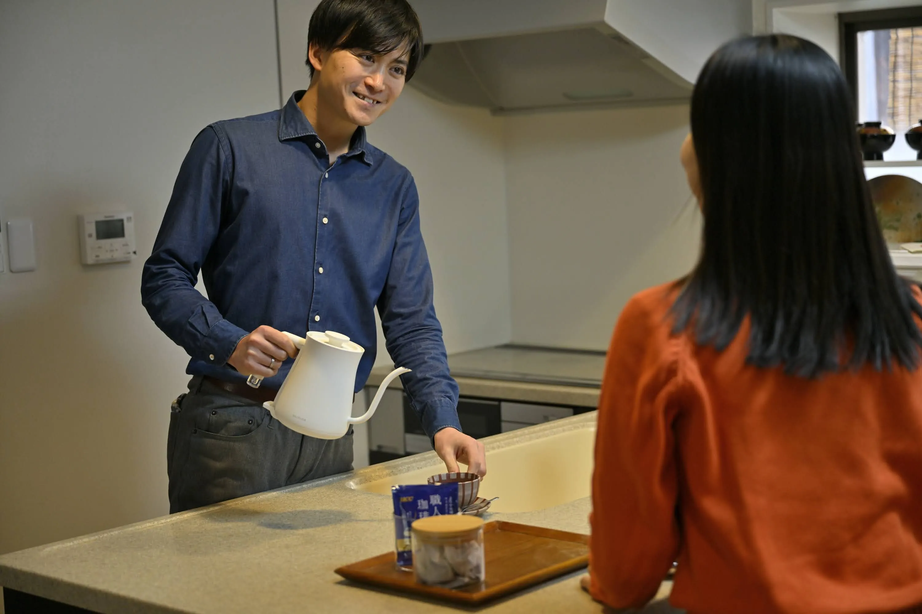 Brew coffee at the counter.